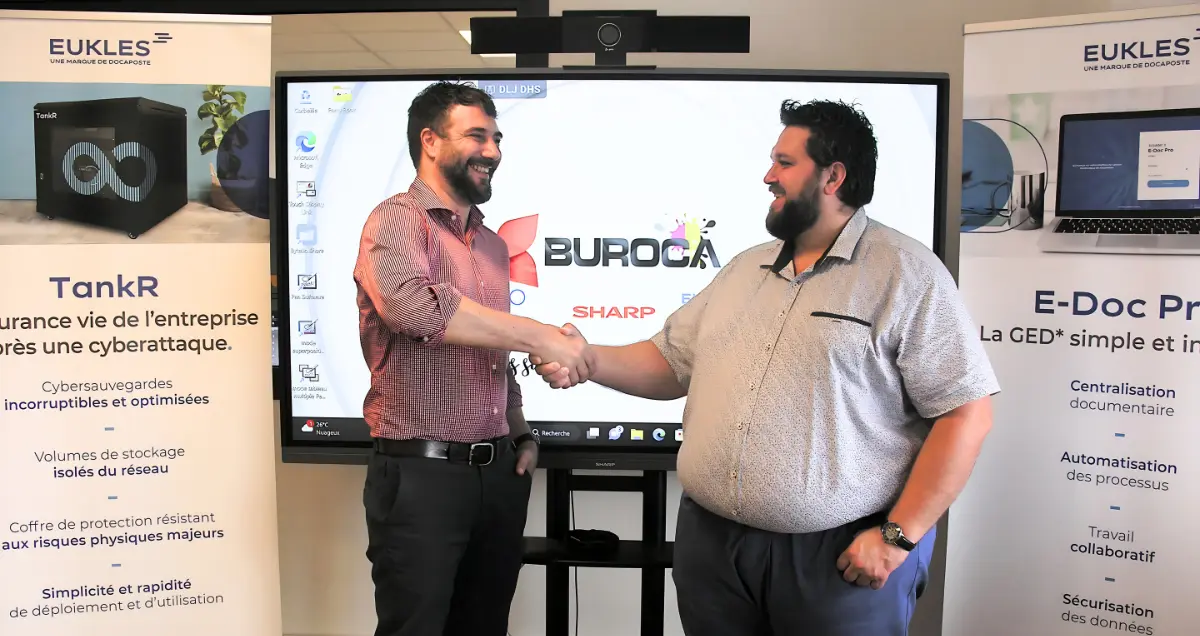 Florent THURNEYSSEN (EUKLES) et Philippe LACOUR (Buroca) se serrant la main